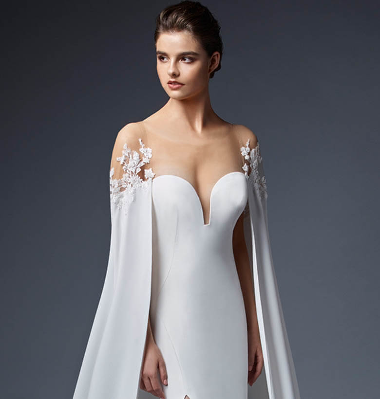 Model wearing a white gown Élysée