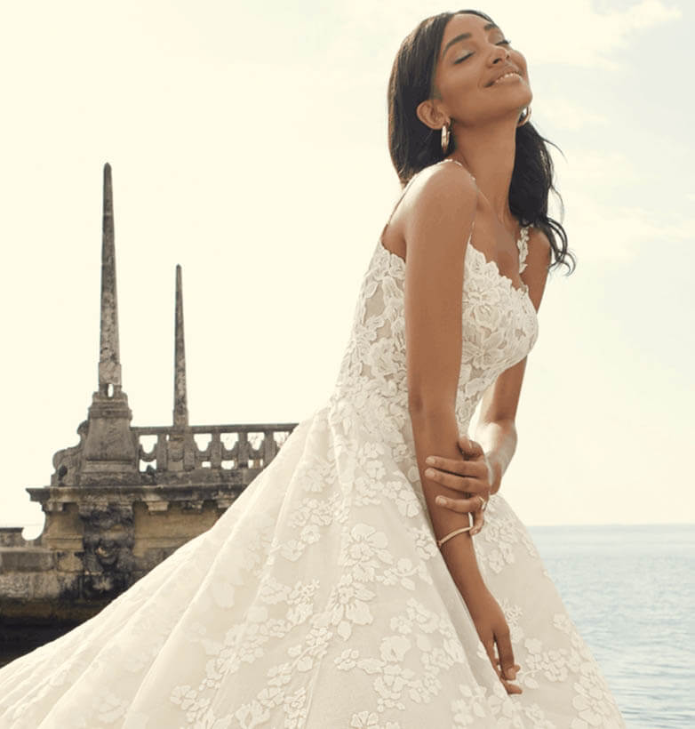 Model wearing a white gown by Sottero & Midgley