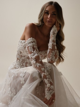 Maggie Sottero  Style #JENASCIA (25SW365A01 - Slit, Unlined bodice, Glitter tulle) #0 Ivory/Silver Accent over Nude (gown with Natural Illusion) thumbnail